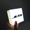 Outdoor illuminated logo of the store