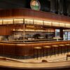 retro walnut wood curved craft beer bar counter with suspended light canopy for brewpub and gastropub