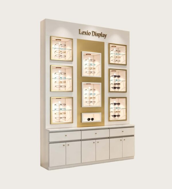 Luxury White & Gold Wall Mounted Eyewear Display Showcase | LED Illuminated Recessed Eyeglass Display Cubbies With Brand Lettering & Drawer Storage Base For High-End Optical Boutiques