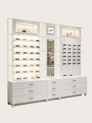 optical cabinets (25) Custom Full White Modular Eyewear Wall Display System | LED Lit Multi-Style Optical Frame & Sunglasses Display Wall With Central Mirror, Large Drawer Storage Base & Decor Niche Shelves For Optical Shop Interior Design