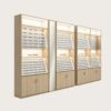 Modular Light Wood Eyewear Display Wall System | LED Backlit Freestanding Optical Frame & Sunglasses Display Cabinets With Central Full-Length Mirror & Bottom Lockable Storage For Optical Shop Layout Design