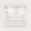 Minimalist All-White Built-In Eyewear Display Wall Unit | LED Recessed Optical Frame Display Racks With Central Brand Logo Panel & Base Storage Cabinets For Premium Optical Store Interior