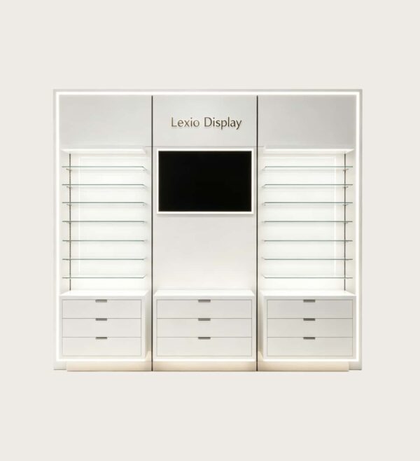Modern Glossy White Wall Eyewear Display Wall | LED Lit Adjustable Glass Shelving Optical Display Unit With Central Digital Screen & Multi-Drawer Base Cabinets For Contemporary Optical Shop Fit-Out