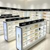 perfume gondola display (25) Wholesale Double Sided Cosmetic Island Display Cabinet | Modern White Open Shelving Retail Perfume Gondola With LED Light Box