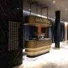 Curved Tiered Gold Black Reception Counter | Custom Luxury Front Desk For Hotel Lobby With LED Lighting