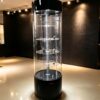 Wholesale Black Gloss Rotating Cylindrical Glass Display Cabinet | LED Lighted Lockable Round Tower Showcase for Jewelry & Watch Boutique