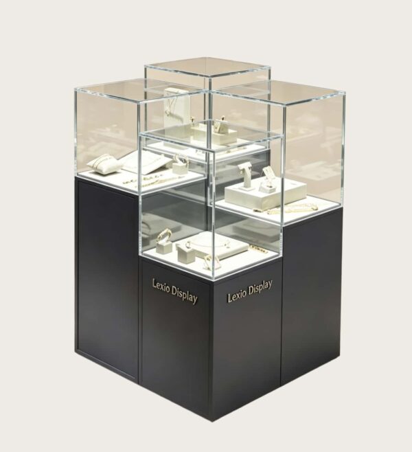 museum display cabinet (1) Staggered multi-tier frameless glass jewelry island display cabinet with matte dark base Lexio Display for luxury jewellery boutique retail