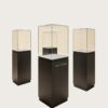 museum display cabinet (10) Frameless ultra-clear glass display case with matte dark square pedestal Lexio Display for sculpture and stone artwork exhibition
