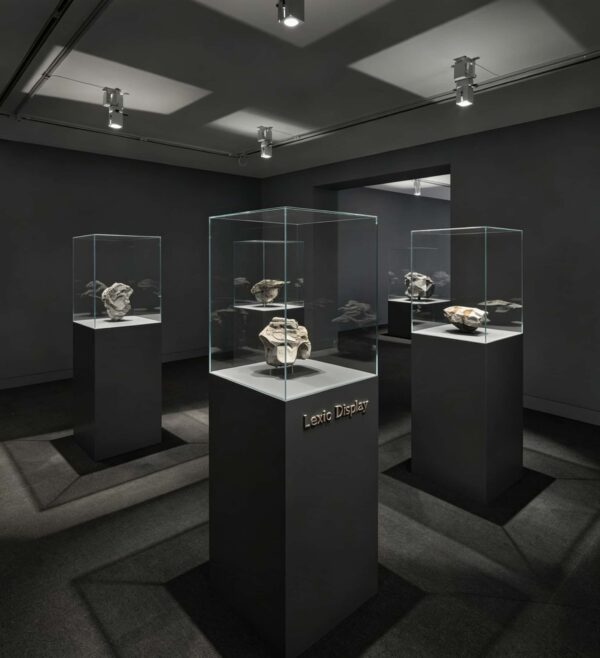 museum display cabinet (11) Frameless ultra-clear glass display case with matte dark square pedestal Lexio Display for sculpture and stone artwork exhibition