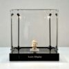 Square clear acrylic display box with adjustable upright LED spotlights and gloss black base Lexio Display for sculpture, antiques and collectibles exhibition