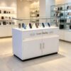 White glass top mobile phone island display counter with drawers storage cabinet and LED light Lexio Display