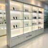 phone display cabinet (11) White modular grid tall wall display cabinet sliding glass doors LED lighting lockable lower cabinets Lexio Display