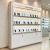 phone display cabinet (13) White tall wall display cabinet straight front glass top LED light custom Lexio Display logo lockable base cabinets for mobile phone shop