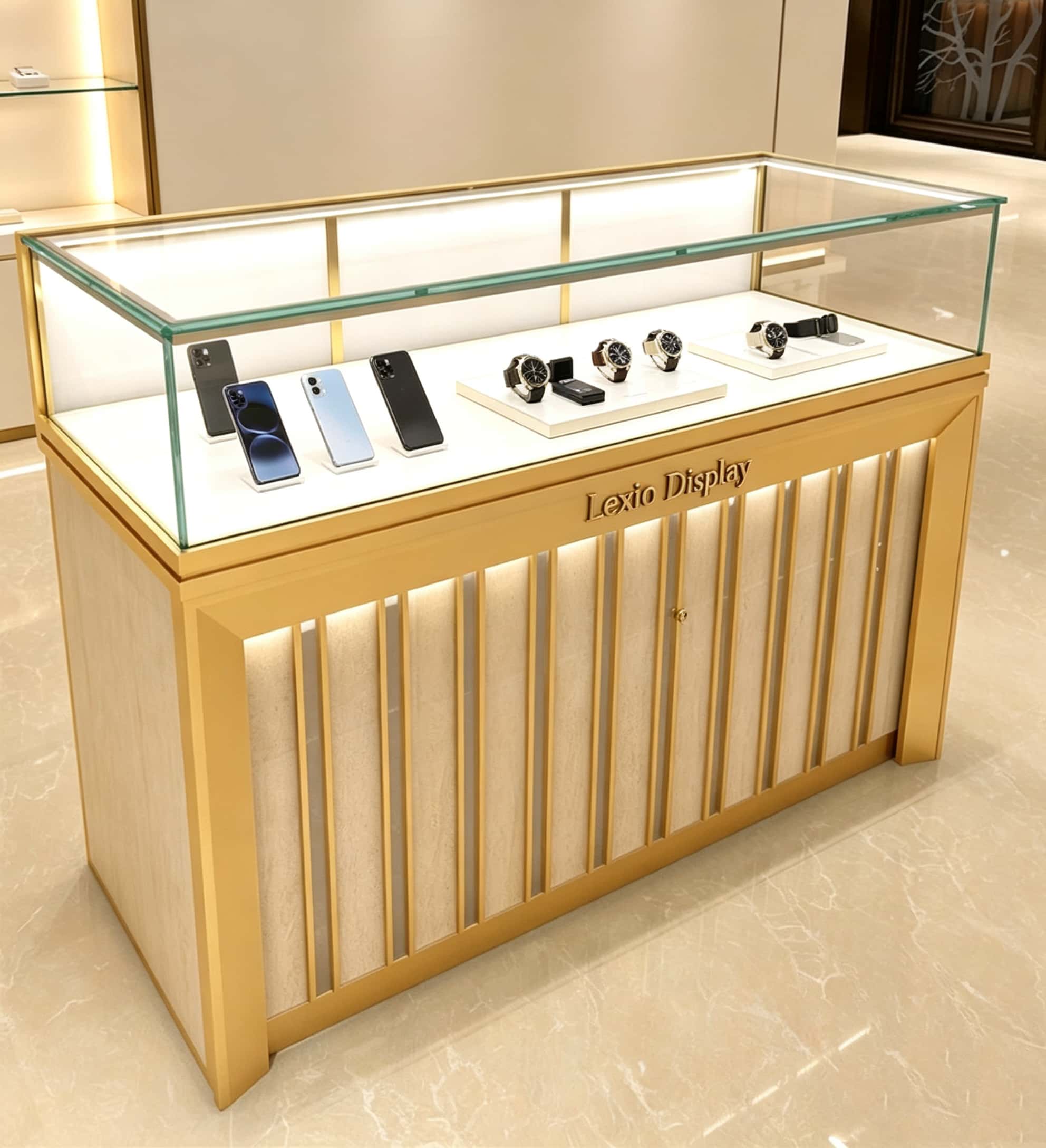 Luxury gold vertical slat glass display counter built‑in LED lighting lockable custom Lexio Display logo for watch and electronics store