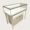 phone display cabinet (28) Slant top glass display counter with tapered high legs built‑in LED lighting custom metal logo Lexio Display for electronics retail
