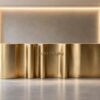 Custom vertical fluted ribbed brushed gold reception desk long wavy lobby front counter Lexio Display
