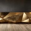 Custom diamond faceted antique distressed gold reception desk 3D geometric metal lobby counter Lexio Display