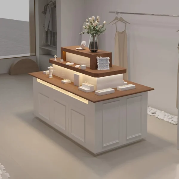 Tiered wooden top pink white jewelry island display counter with LED light Lexio Display retail showcase for jewelry boutique clothing store