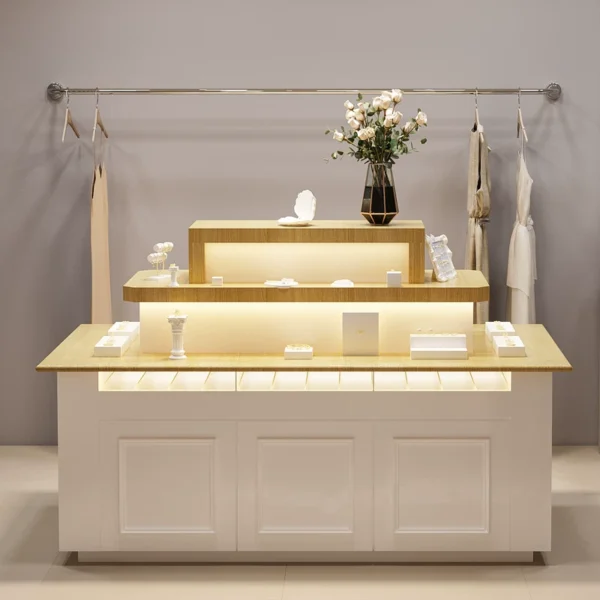 Tiered wooden top pink white jewelry island display counter with LED light Lexio Display retail showcase for jewelry boutique clothing store