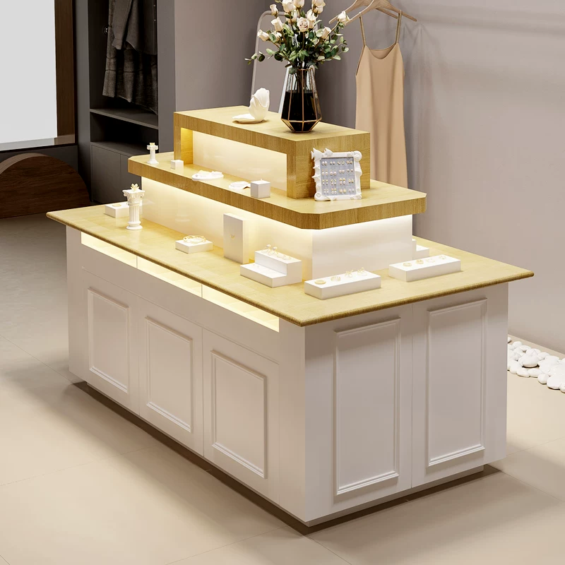 Tiered wooden top pink white jewelry island display counter with LED light Lexio Display retail showcase for jewelry boutique clothing store