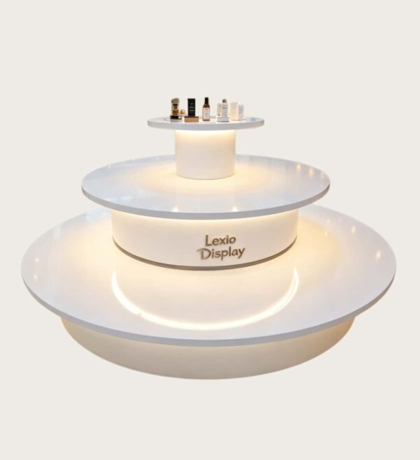 retail display stands (1) Gloss pure white three-tier circular tiered LED lighted retail island display table Lexio Display for cosmetic boutique and shopping mall pop-up showcase