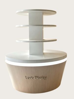 retail display stands (19) Four-tier round retail display stand wood grain tapered base with warm LED lighting white shelves Lexio Display for café bakery and mall food retail
