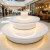 retail display stands (3) Gloss pure white three-tier circular tiered LED lighted retail island display table Lexio Display for cosmetic boutique and shopping mall pop-up showcase