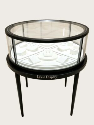 retail display stands (6) Round glass top jewelry display showcase black metal frame tapered legs white velvet interior Lexio Display for luxury jewellery boutique retail