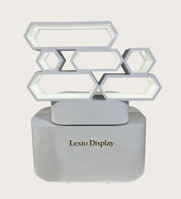 White glossy honeycomb hexagon LED lighted retail island display stand curved base Lexio Display for mall café and beverage product pop-up promotion