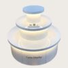 Light blue white three-tier cylindrical LED glowing retail island display stand Lexio Display for electronics cosmetic boutique and mall pop-up showcase