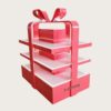retail display stands (8) Glossy red gift box shaped three-tier LED lighted retail island display stand with decorative bow Lexio Display for mall seasonal holiday gift promotion
