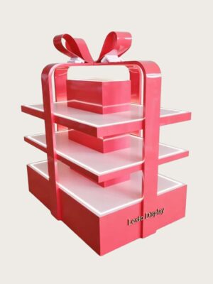 retail display stands (8) Glossy red gift box shaped three-tier LED lighted retail island display stand with decorative bow Lexio Display for mall seasonal holiday gift promotion