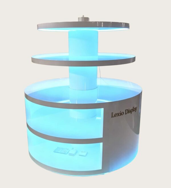 retail display stands (9) Round three-tier LED lighted retail island display stand white glossy with glowing base shelves Lexio Display for shopping mall cosmetics and electronics promotion