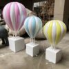 Fiberglass striped pastel hot air balloon sculptures with white square plinth bases Lexio Display for shopping mall, wedding, event photo prop decoration