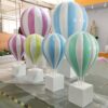 Fiberglass striped pastel hot air balloon sculptures with white square plinth bases Lexio Display for shopping mall, wedding, event photo prop decoration