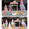 Fiberglass ice‑cream theme sculpture set with candy‑colored photo booth frame, outdoor mall commercial decorative statues Lexio Display for retail photo‑op marketing installation