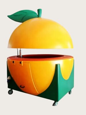 Giant orange‑shaped fiberglass mobile juice vending cart with hydraulic lifting dome lid and leaf sculpture, fruit themed kiosk with wheels Lexio Display