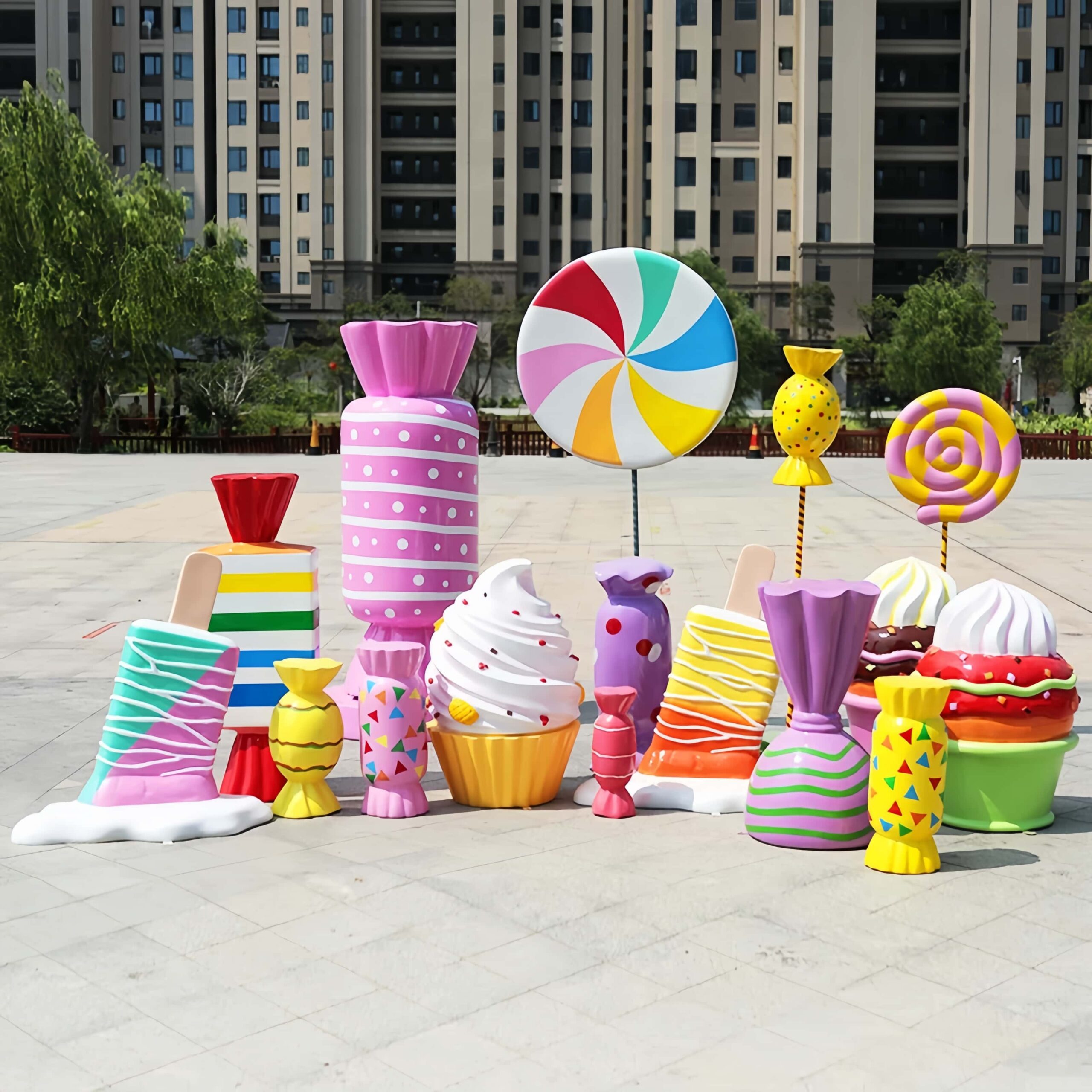 Bright colorful fiberglass candy lollipop cupcake sculpture set Lexio Display, outdoor sweet‑theme decorative statues for shopping mall plaza retail event decoration