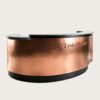 U‑shape semi‑circular reception desk with hand hammered copper cladding and natural granite stone top, curved luxury lobby front counter Lexio Display for premium hospitality interior fit‑out
