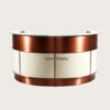 U‑curved circular office reception desk with brushed copper metal framing, cream lacquer panels and clear tempered glass top, modern corporate lobby front counter Lexio Display