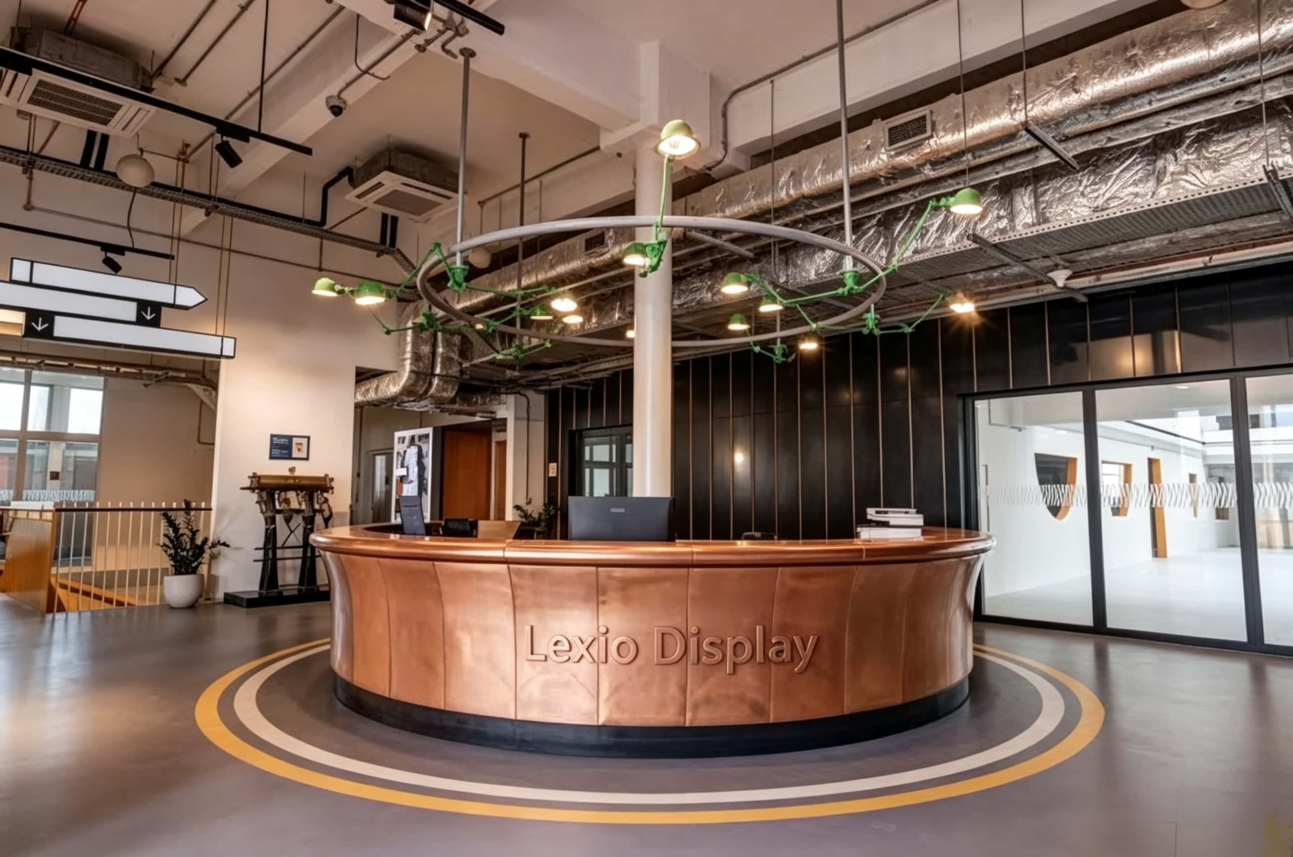 U‑shape curved reception desk with vertical panel aged patina copper cladding, vintage industrial‑style lobby front counter Lexio Display for loft and commercial space