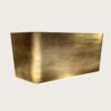 hammered copper reception desk (16) Chamfered angular reception desk with textured forged aged brass metal cladding, floating base LED glow luxury office lobby front desk Lexio Display for premium commercial fit‑out
