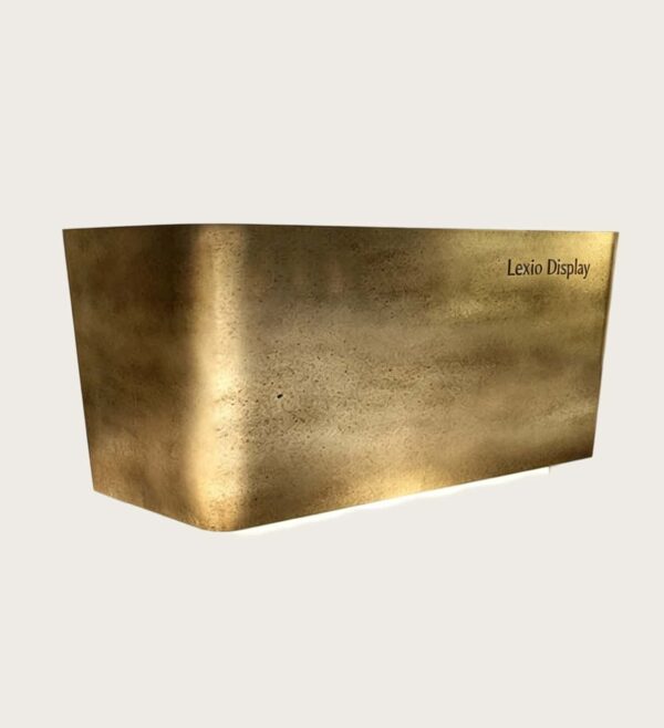 hammered copper reception desk (16) Chamfered angular reception desk with textured forged aged brass metal cladding, floating base LED glow luxury office lobby front desk Lexio Display for premium commercial fit‑out