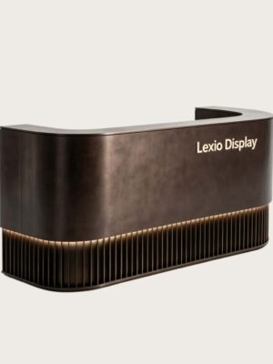 U‑shaped curved aged bronze reception desk with vertical fluted base and warm LED strip lighting, luxury lobby front counter Lexio Display for premium commercial interior fit‑out