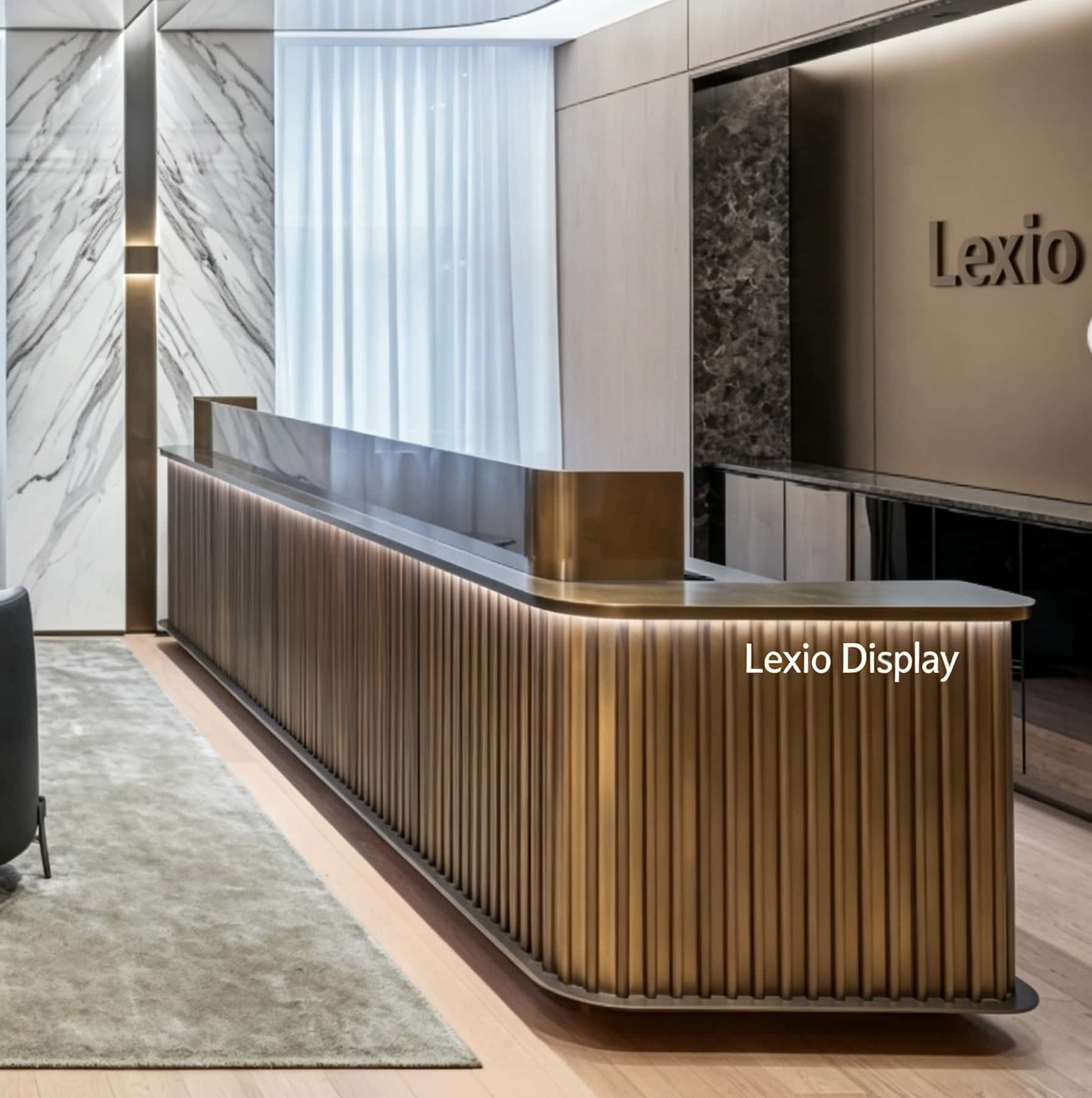 Fluted antique brass L-shaped reception desk with dark marble top and LED ambient light, luxury office lobby front counter Lexio Display for high-end corporate interior