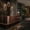 U‑shaped curved aged bronze reception desk with vertical fluted base and warm LED strip lighting, luxury lobby front counter Lexio Display for premium commercial interior fit‑out