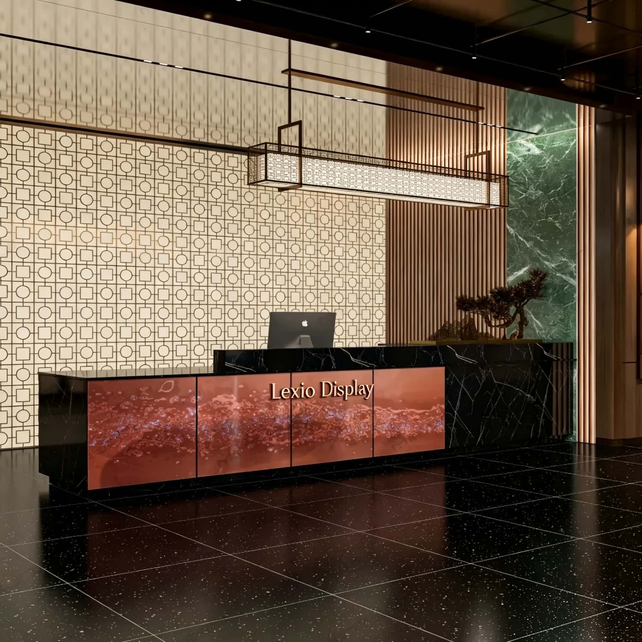 Tiered luxury reception desk with black marble top and etched patina copper art panel, LED illuminated corporate lobby front counter Lexio Display for premium commercial interior