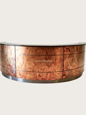 U‑shape curved reception desk with unique heat‑treated flame‑pattern patina copper cladding, black stone countertop artistic luxury lobby counter Lexio Display