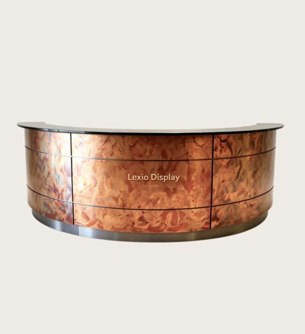 U‑shape curved reception desk with unique heat‑treated flame‑pattern patina copper cladding, black stone countertop artistic luxury lobby counter Lexio Display