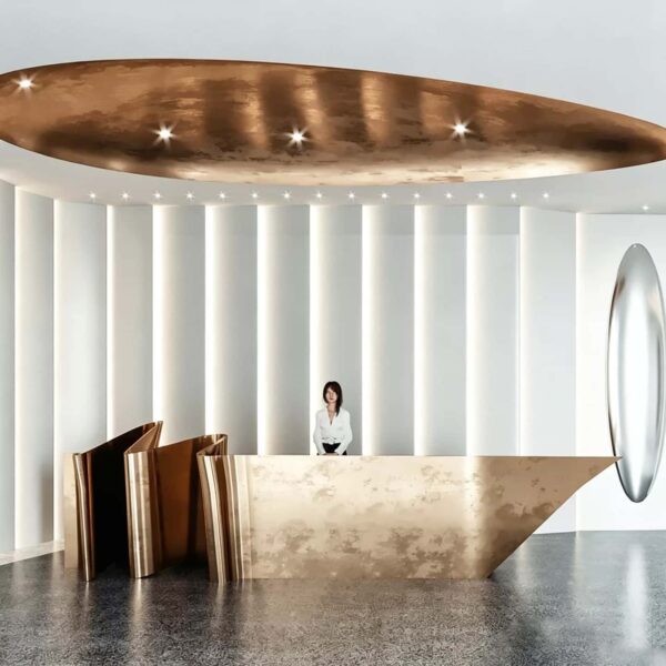 Origami‑style folded metal irregular luxury reception desk, artistic lobby front counter Lexio Display for modern high‑end commercial interior